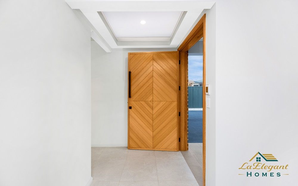 Entry hallway of a completed LA Elegant Homes build, looking back to the timber front door