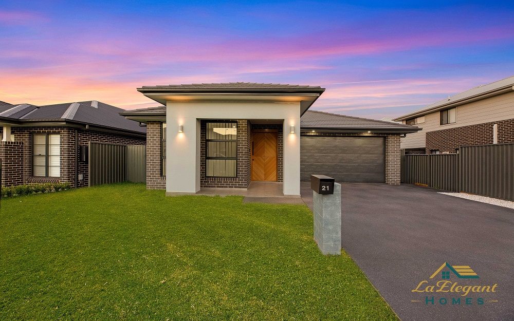 Completed custom home at Gregory Hills photographed at dusk, built by LA Elegant Homes