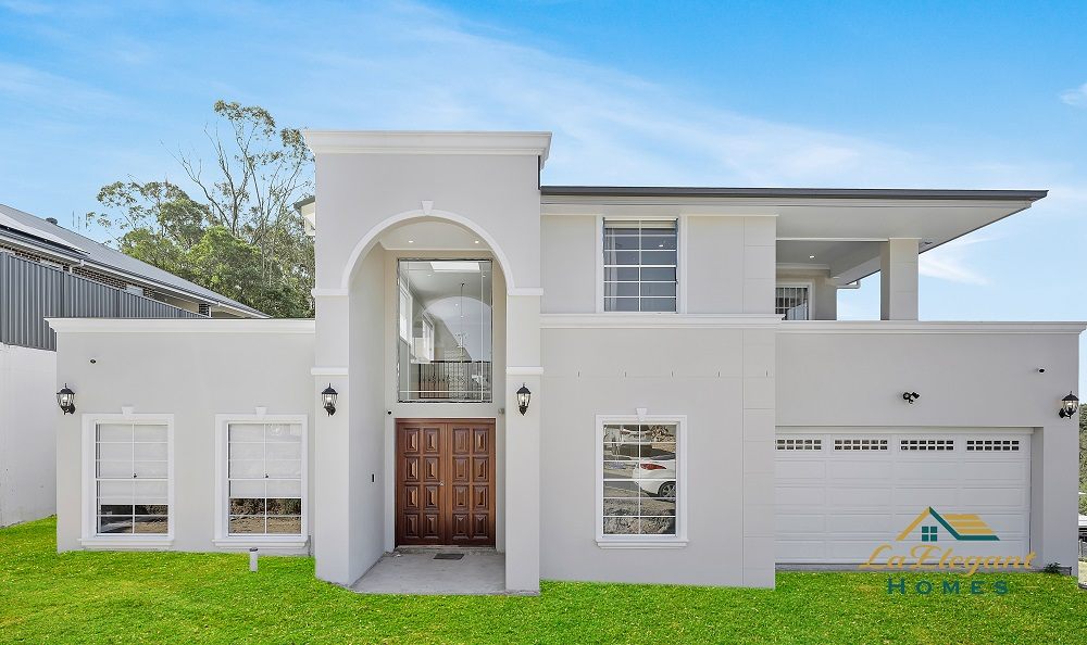 White rendered two-storey façade with an arched entry on a completed Kellyville custom home
