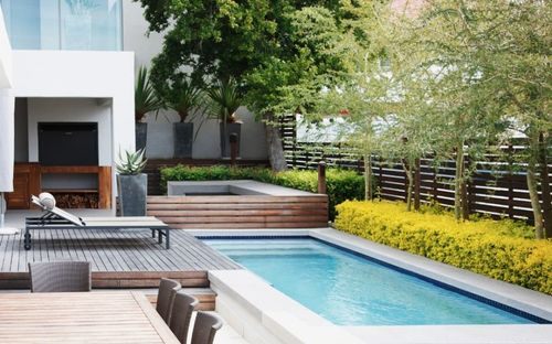 Home extension with large glazing opening onto a landscaped rear garden