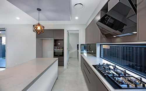 Renovated interior with new kitchen joinery, stone benchtop and timber flooring